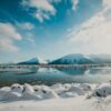 snow covered mountain reflections at daytime